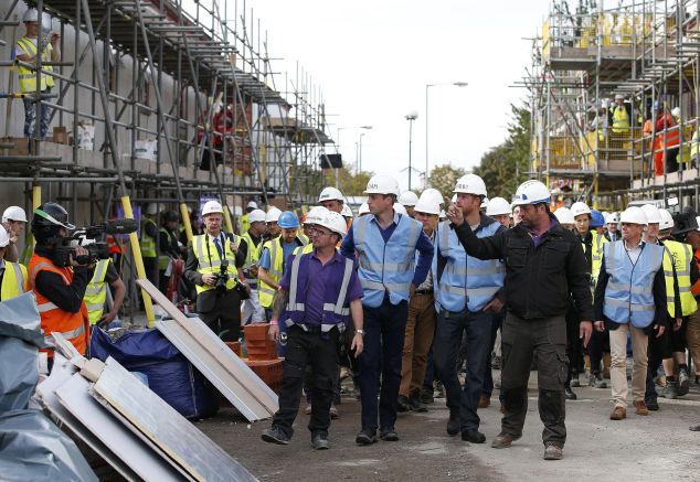 The brothers touring the construction site. (Photo: PHIL NOBLE/AFP/Getty Images)