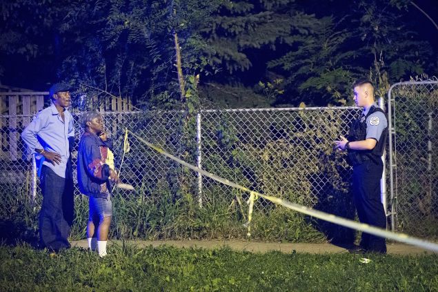 CHICAGO, IL - SEPTEMBER 28: Police officers secure a shooting scene where 5 people were reported to have been shot, including an 11-month-old infant, on September 28, 2015 in Chicago, Illinois. Chicago, like many major cities in the United States, has experienced a surge in shootings this year. (Photo by Scott Olson/Getty Images)