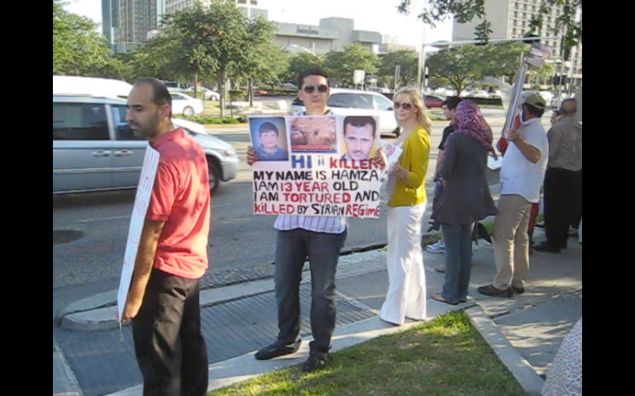 This photo of protestors demanding action against Assad was taken in Houston on May 29, 2011—more than four years ago. Since then, more than 11 million Syrians have been displaced and more than 220,000 killed. The boy pictured on the sign is Hamza Ali Al-Khateeb, (New York Observer)