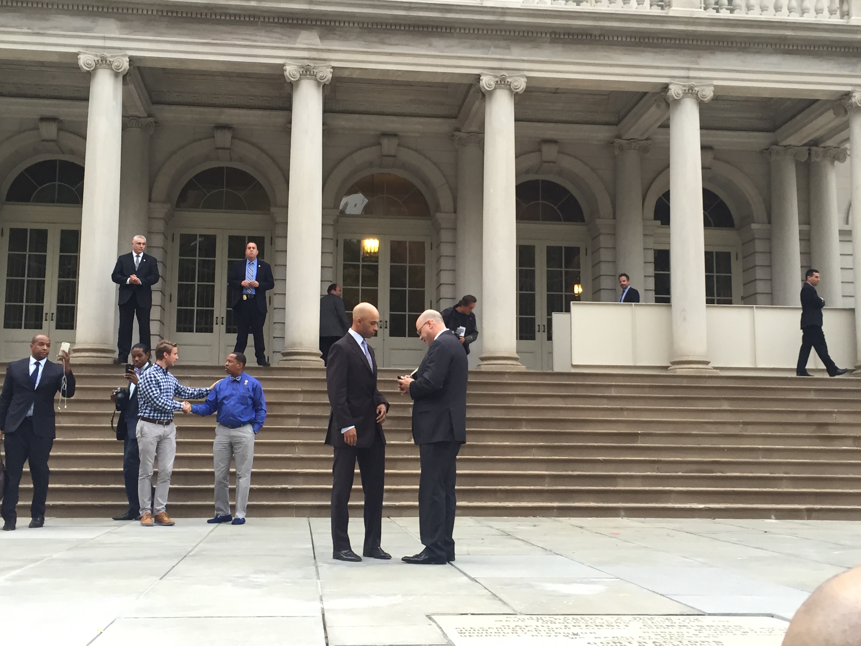 Tennis player James Blake talks with his lawyer Kevin Marino outside City Hall. (Photo: Jillian Jorgensen for Observer)
