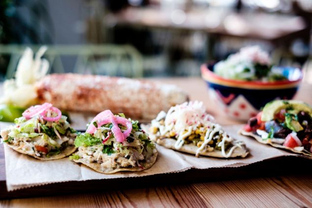 Tostadas de salpicon de atun, tlacoyo and tlayuda Oaxaquena at Rosie's. (Photo: Chris Sorensen/For New York Observer)