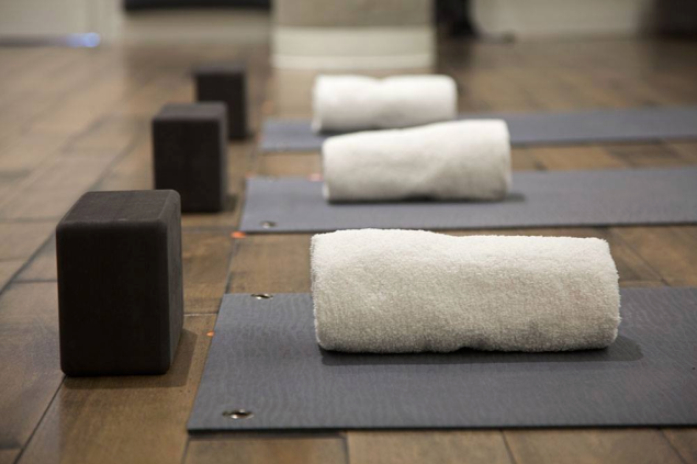 When trying hot yoga, prepare to use those towels—a lot. Photo: Facebook/Tangerine Hot Power Yoga)