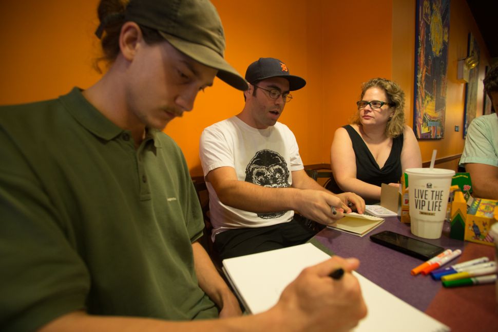 Jason Polan (middle) has been throwing the Taco Bell eat and draw for 10 years. - Aaron Adler for New York Observer