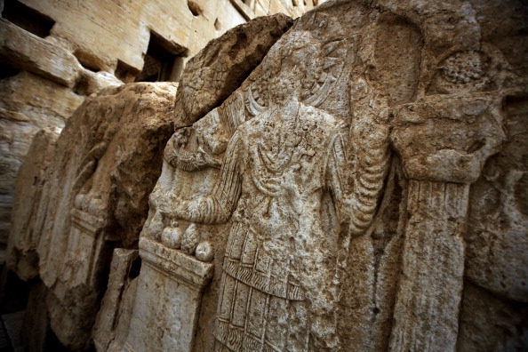 A picture taken on March 14, 2014 shows carvings on a wall in the courtyard of the sanctury of Baal in the ancient oasis city of Palmyra, 215 kilometres northeast of Damascus. From the 1st to the 2nd century, the art and architecture of Palmyra, standing at the crossroads of several civilizations, married Graeco-Roman techniques with local traditions and Persian influences. AFP PHOTO/JOSEPH EID (Photo credit should read JOSEPH EID/AFP/Getty Images)