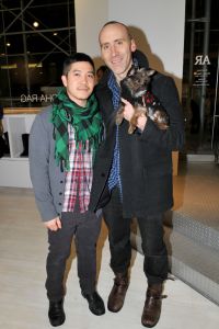 Thakoon Panichgul with his partner, Russ Spina, and their Yorkie/Chihuahua mix, Stevie - the new residents of a $2.7 million TriBeCa loft. (JONATHON ZIEGLER/Patrick McMullan)