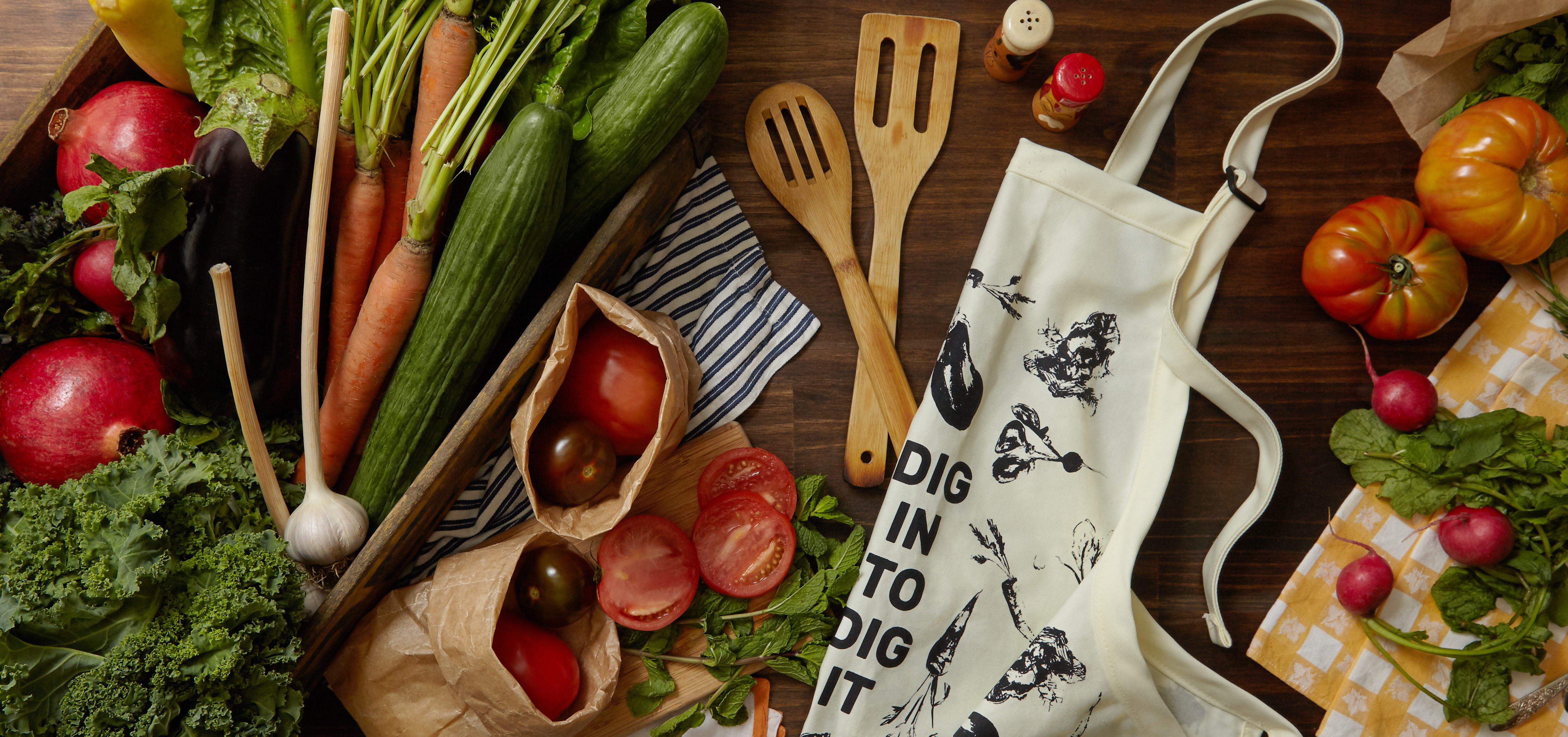 The "Food for Thought, Food for Life" collection will also feature a cotton twill apron that reads "Dig in to Dit it."
