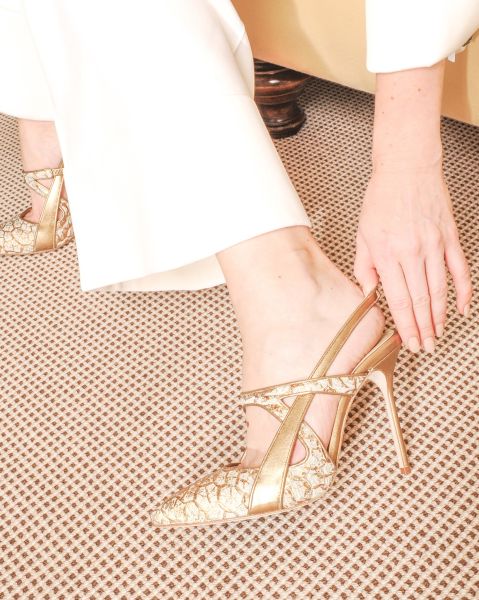 The designer shows off a finished creation (Photo: Courtesy Sarah Flint)