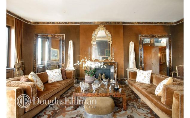 The living room; we're pretty sure the floral pillows are new.