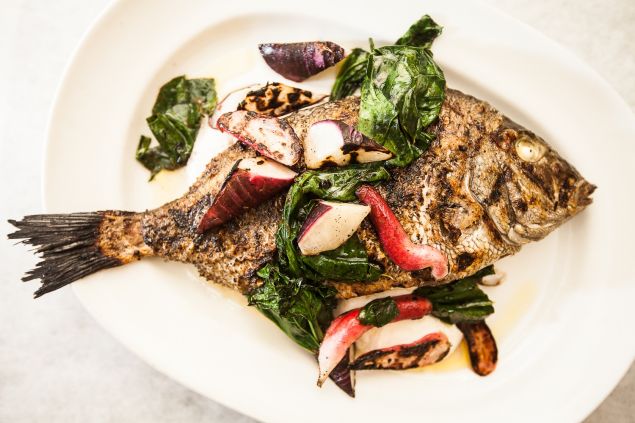 Whole porgy stuffed with lemon. (Photo: Emily Assiran for Observer)