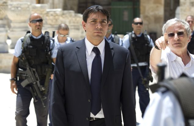 Surrounded by security Deputy Speaker of the Israeli parliament, Danny Danon is taken on a tour of the Temple Mount or Al-Aqsa Mosque Compound the holy site for Judaism and the Islam in Israeli annexed east Jerusalem's old City July 20, 2010, during the 9th of Av day of mourning for the destruction of the First and Second holy temples. AFP PHOTO/AHMAD GHARABLI (Photo credit should read AHMAD GHARABLI/AFP/Getty Images)