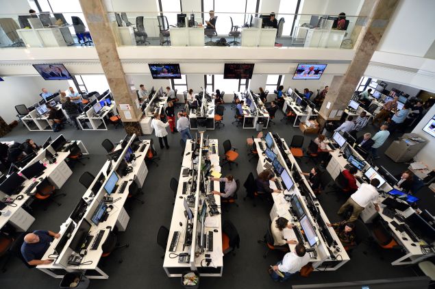 Journalists work in the main newsroom area of the new Al Jazeera America television broadcast studio on West 34th Street August 16, 2013 in New York. Al Jazeera America, which will launch on August 20, will have its headquarters in New York. AFP PHOTO/Stan HONDA (Photo credit should read STAN HONDA/AFP/Getty Images)