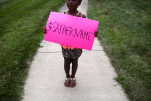 LISLE, IL - JULY 25: Daija Belcher, 5, holds a sign in front of the DuPage African Methodist Episcopal Church during the funeral service for Sandra Bland on July 25, 2015 in Lisle, Illinois. Bland's death roused suspicion nationwide after the 28-year-old was found hanging from a plastic bag three days after she was pulled over by a Texas State Trooper for a traffic violation. (Photo by Jonathan Gibby/Getty Images)