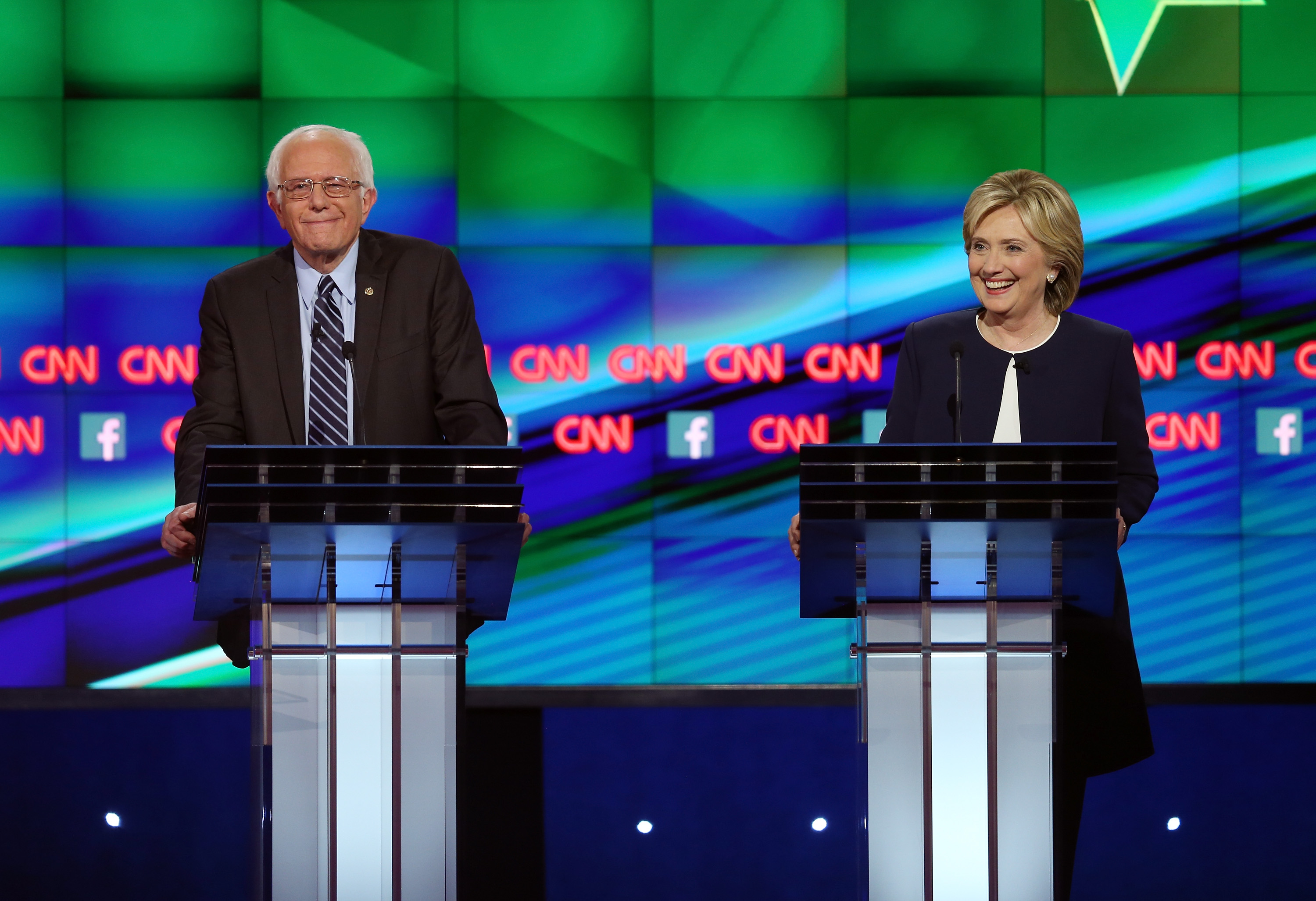 Democratic presidential candidates Sen. Bernie Sanders and Hillary Clinton take part in a presidential debate. (Photo by Joe Raedle/Getty Images)