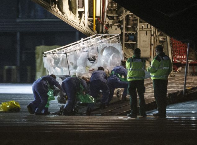 (FILES) A file photo taken on December 30, 2014, shows medical personnel wheel a quarantine tent trolley containing Scottish healthcare worker Pauline Cafferkey, who was diagnosed with Ebola after returning to Scotland from Sierra Leone, into a Hercules Transport plane at Glasgow International Airport, bound for The Royal Free hospital in London. British nurse Pauline Cafferkey who was successfully treated in January 2015 after contracting Ebola in Sierra Leone is now "critically ill" due to a resurgence of the virus, the hospital treating her said on October 14, 2015. "We are sad to announce that Pauline Cafferkey's condition has deteriorated and she is now critically ill. Pauline is being treated for Ebola in the high-level isolation unit at the Royal Free Hospital," it said in a statement. AFP PHOTO / STR (Photo credit should read -/AFP/Getty Images)