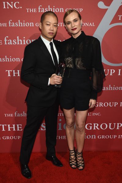 Jason Wu poses with his presenter, Diane Kruger (Photo: Dimitrios Kambouris/Getty Images).