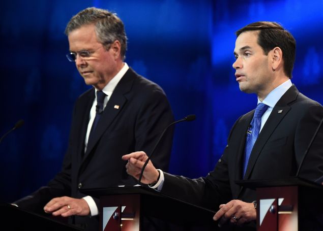 Republican Presidential hopeful Marco Rubio (R) speaks as Jeb Bush looks on during the CNBC Republican Presidential Debate, October 28, 2015 at the Coors Event Center at the University of Colorado in Boulder, Colorado. AFP PHOTO/ ROBYN BECK (Photo credit should read ROBYN BECK/AFP/Getty Images)