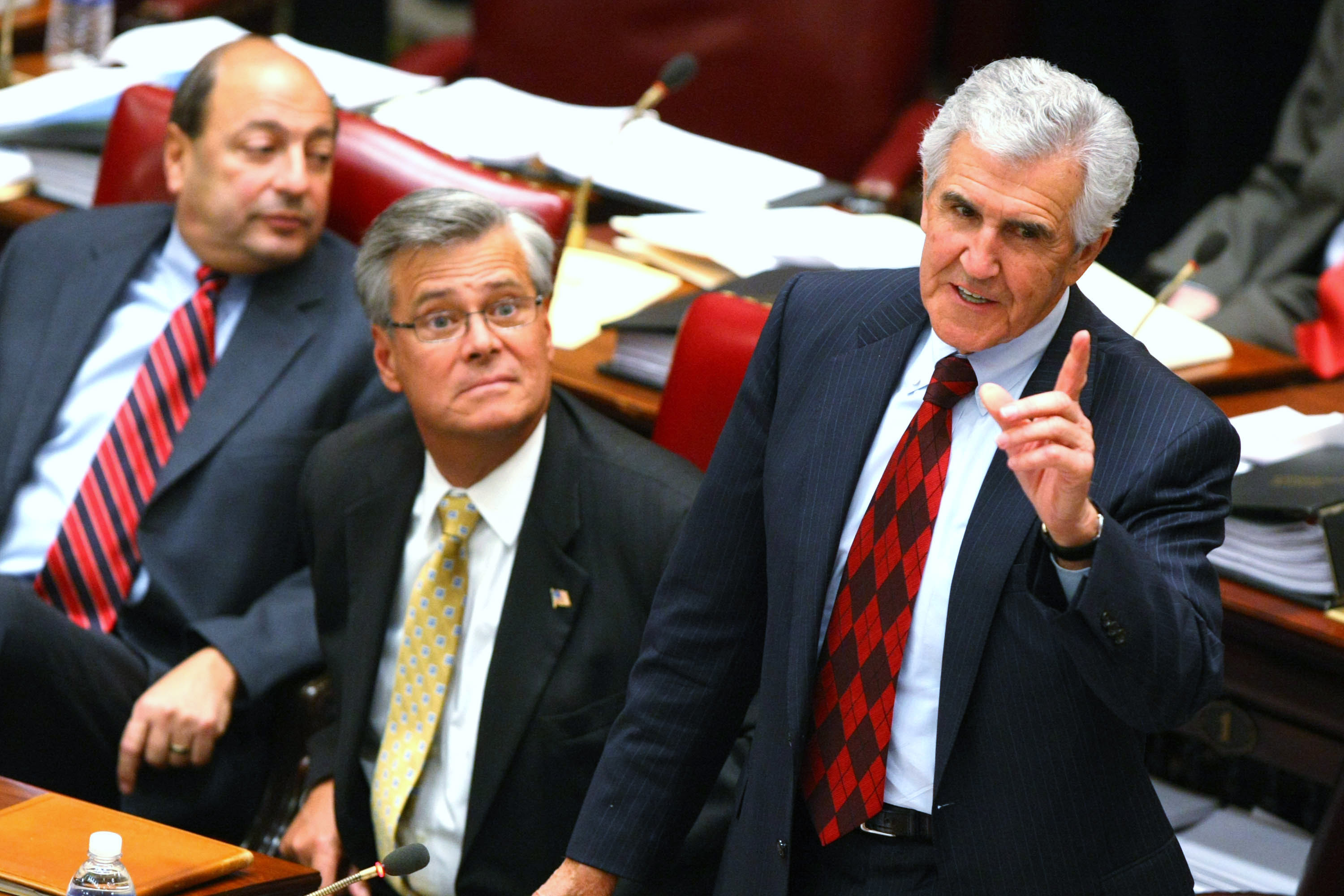 Former Majority Leader Joseph Bruno stands to speak, as future (and now also former) Majority Leader Dean Skelos sits to his left. (Photo by Daniel Barry/Getty Images)