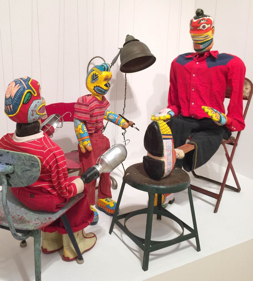 Karl Wirsum, (left to right) “Jimmy Jones Brother Jack, Jimmy Jones Junior, Tree Son” (c. 1973-1974), acrylic, wood, fabric, leather, soldering pen, papier-mâché, and light fixtures, dimensions variable (Photo: Courtesy of Derek Eller Gallery, New York)
