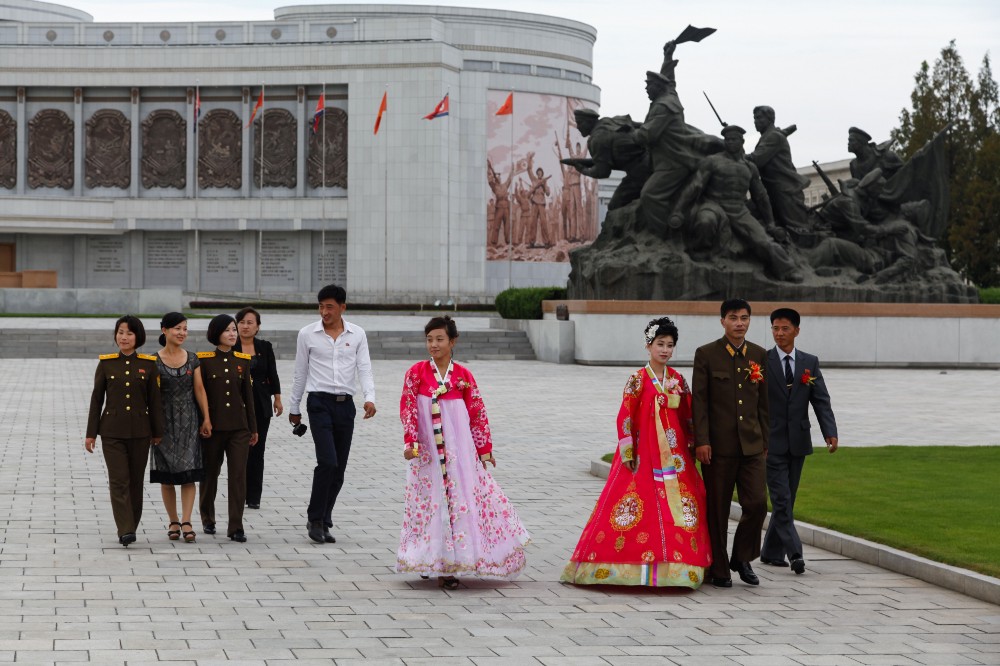 Newlyweds taking photographs at the Korean War Museum