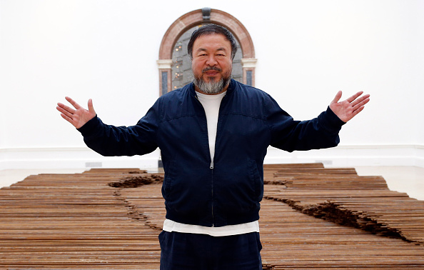 LONDON, UNITED KINGDOM - SEPTEMBER 15: Ai Weiwei stands with his sculpture 'Straight' as he previews works from His landmark art exhibition on September 15, 2015 in London, England. The Royal Academy of Art is showing the work of one of China's leading contemporary artists until mid-December. Ai Weiwei's activism in China saw him detained without charge in 2011 for 81 days. (Photo by Alex B. Huckle/Getty Images)