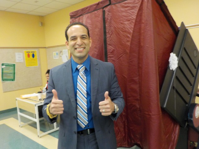 Carmelo Garcia leaves the voting booth on Election Day.