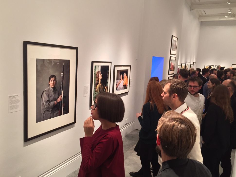 Visitors at the National Portrait Gallery look at Joey Lawrence's portrait of 'Sarya.' (Photo: Joey Lawrence)