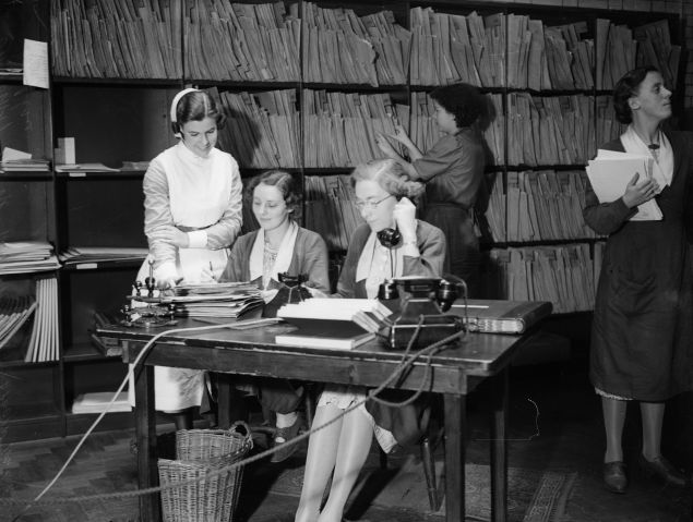 1939: Receptionists taking calls in the appointments department of University College Hospital, London. (Photo by General Photographic Agency/Getty Images)