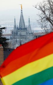 SLAT LAKE CITY, UT - JANUARY 28: The Salt Lake Temple of the Church of Jesus Christ of Latter-Day Saints sits in the background as several hundred people hold a pro-gay marriage rally outside the Utah State Capitol on January 28, 2014 in Salt Lake City, Utah. Several weeks ago a federal judge ruled unconstitutional a voter-approved ban on same-sex marriage in the state of Utah. The ruling has since been stayed and is working it's way through the legal system. (Photo by George Frey/Getty Images)