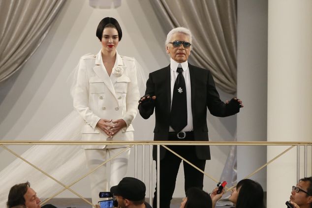 Kendall Jenner and Karl Lagerfeld take a bow (Photo: Patrick Kovarik/AFP/Getty Images).