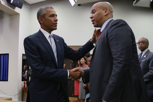 WASHINGTON, DC - SEPTEMBER 18: (AFP OUT) U.S. President Barack Obama (L) greets Sen. Corey Booker (D-NJ) during a gathering of actors, hip-hip artists, justice activists, state and local elected officials and community leaders advocating for criminal justice reform in the Eisenhower Executive Office Building South Court Auditorium September 18, 2015 in Washington, DC. The leaders gathered for a screening of "Fixing the System," an upcoming special documentary about criminal justice reform. (Photo by Chip Somodevilla/Getty Images)