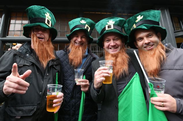 Rugby fans pose for a photograph outside a pub. (Photo by Matt Cardy/Getty Images)