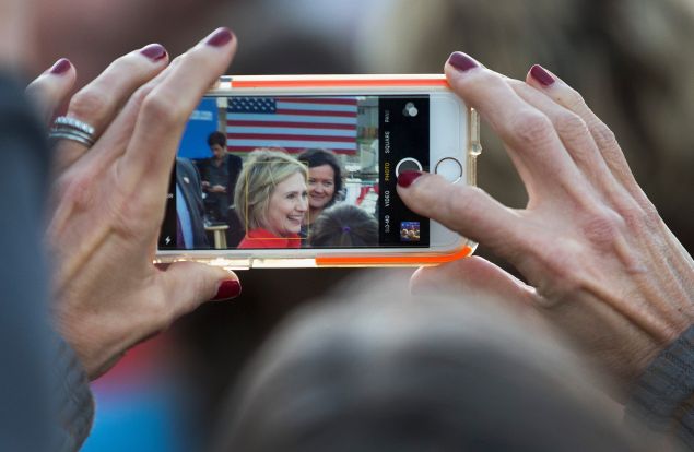 CORALVILLE, IA - NOVEMBER 03: A woman takes a picture with her phone as Democratic presidential candidate Hillary Clinton greets guests after speaking at a campaign event on November 3, 2015 in Coralville, Iowa. A recently released poll has Clinton expanding her lead over rival Bernie Sanders in their quest for the Democratic nomination for president. (Photo by Scott Olson/Getty Images)