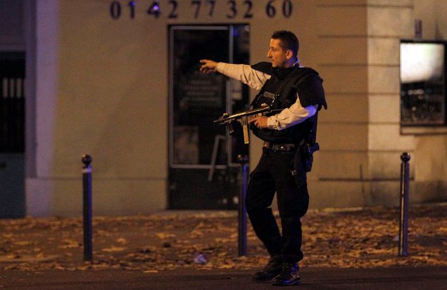 PARIS, FRANCE - NOVEMBER 13: Police survey the area of Boulevard Baumarchais after an attack in the French capital on November 13, 2015 in Paris, France. At least 18 people were killed in a series of gun attacks across Paris, as well as explosions outside the national stadium where France was hosting Germany. (Photo by Thierry Chesnot/Getty Images)