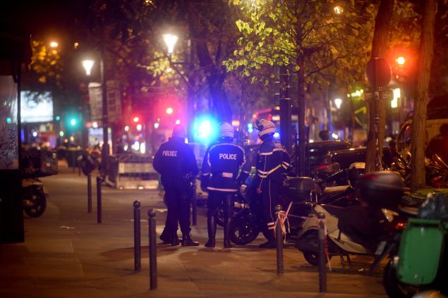 PARIS, FRANCE - NOVEMBER 13: Policemen patrol the streets during gunfire near the Bataclan concert hall on November 13, 2015 in Paris, France. Gunfire and explosions in multiple locations erupted in the French capital with early casualty reports indicating at least 60 dead. (Photo by Antoine Antoniol/Getty Images)