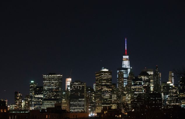 One World Trade Center's spire is shown lit in French flags colors of white, blue and red in solidarity with France after tonight's terror attacks in Paris. (Photo: Daniel Pierce Wright for Getty Images)