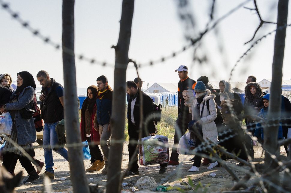 Migrants and refugees cross the Greek-Macedonian border near Gevgelija in November 2015. 