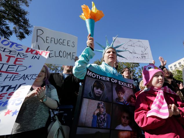 AUSTIN, TX - NOVEMBER 22: Members of The Syrian People Solidarity Group protest on November 22, 2015 in Austin, Texas. The group was protesting Texas governor Greg Abbott's refusal to allow Syrian refugees in the state. (Photo by Erich Schlegel/Getty Images)
