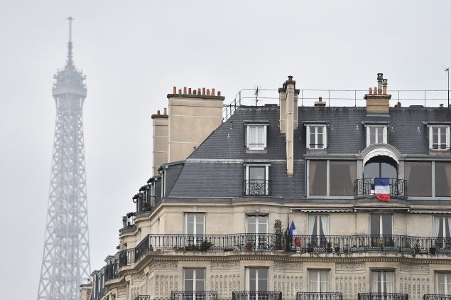PARIS, FRANCE - NOVEMBER 27: National French flag is in display at windows during The National Tribute to The Victims of The Paris Terrorist Attacks at Les Invalides on November 27, 2015 in Paris, France. (Photo by Pascal Le Segretain/Getty Images)