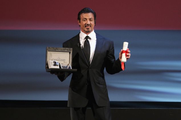 VENICE, ITALY - SEPTEMBER 12: Actor Sylvester Stallone poses with his Lifetime Achievement award while attending the Closing Ceremony at the Sala Grande during the 66th Venice Film Festival on September 12, 2009 in Venice, Italy.