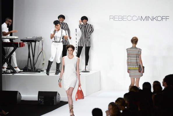 NEW YORK, NY - SEPTEMBER 06: Models walk the runway at the Rebecca Minkoff Spring 2014 runway show while musician Janelle Monae performs during Mercedes-Benz Fashion Week Spring 2014 at Lincoln Center for the Performing Arts on September 6, 2013 in New York City. (Photo by Andrew H. Walker/Getty Images for Mercedes-Benz Fashion Week)