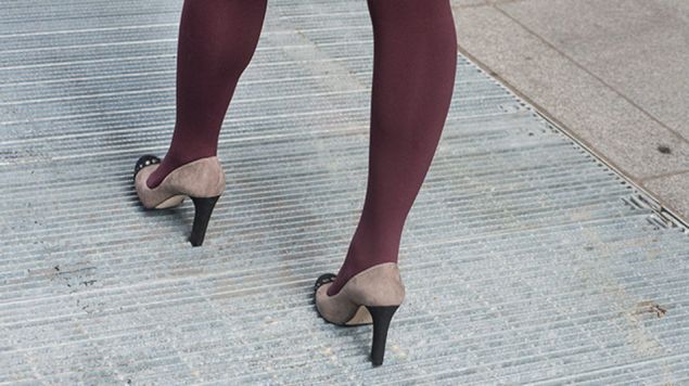 A woman walks fearlessly over the previously shoe destroying grates (Photo: The MTA).