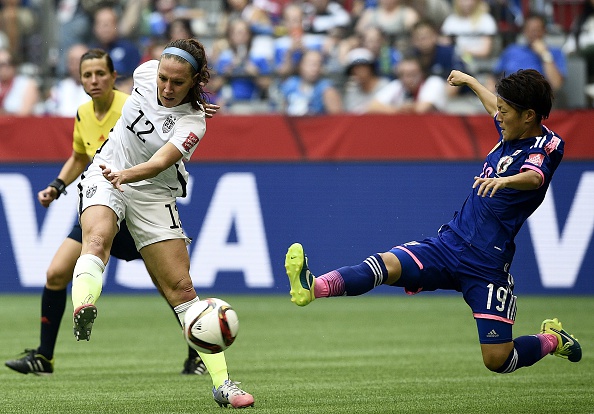 USA midfielder Lauren Holiday shoots in front of Japan's defender Saori Ariyoshi during the 2015 FIFA Women's World Cup final in Vancouver on July 5, 2015. (Photo: Frank Fife/AFP/Getty)