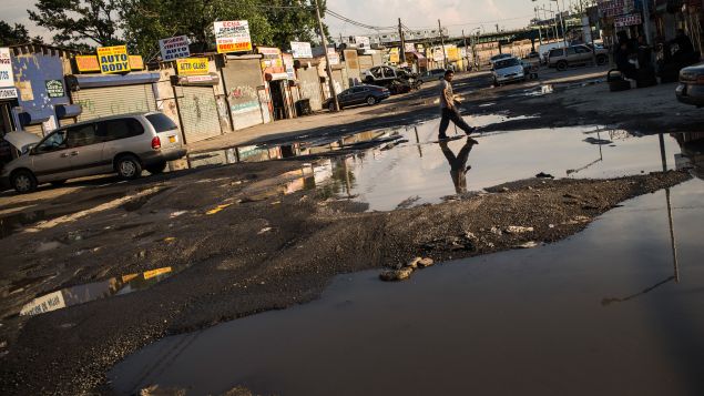 A flooded street in Willets Point. (Photo: Andrew Burton for Getty Images)