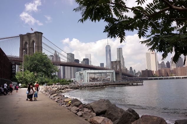 NEW YORK, NY - AUGUST 19: The Brooklyn Bridge is viewed from a park in in DUMBO, an acronym for Down Under the Manhattan Bridge Overpass, on August 19, 2014 in the Brooklyn borough of New York City. Brooklyn, once a quiet and affordable borough across from Manhattan, is now home to some of the most ambitious projects in New York City. The Atlantic Yards development project, the Brooklyn Bridge Park and the building of residential towers in downtown Brooklyn are just a few of the development projects quickly transforming the borough. In the first half of 2014 alone total investment property sales in Brooklyn rose 38 percent from the first half of 2013 to 884. (Photo by Spencer Platt/Getty Images)