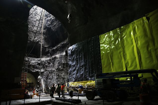 NEW YORK, NY - JANUARY 10: Workers are viewed in a tunnel underneath Manhattan at the Second Avenue Subway project site on January 10, 2014 in New York City. New York City's long awaited Second Avenue Subway line, which will extend the route of the Q train into the Upper East Side, has been delayed since plans were first proposed in the 1920s and 1940s. Building the subway line has involved digging 8.5 miles of new tunnel from 125th Street in Harlem south to Hanover Square, which is located in Manhattan's Financial District. The total cost of the project is expected to top $17 billion and is scheduled to open for service in December 2016. (Photo by Spencer Platt/Getty Images)