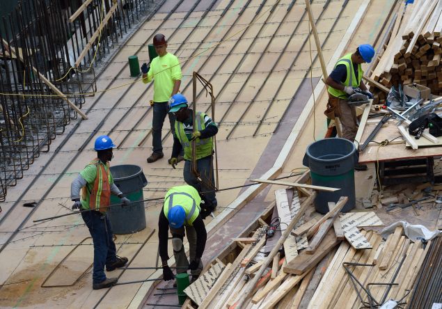 Workers on a building under construction (Photo: Don Emmert for AFP/Getty Images)