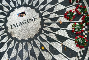 Crowds gathered in Central Park at the Strawberry Fields Memorial to remember the life of John Lennon on the 35th anniversary of his death