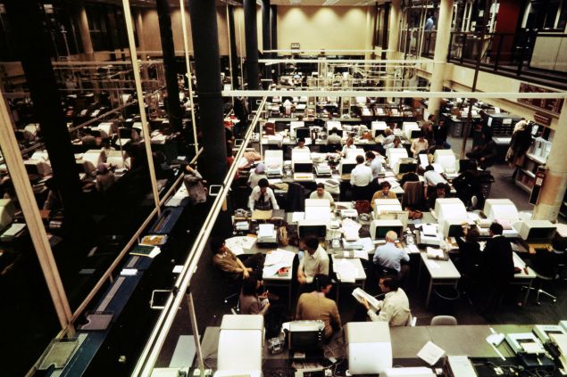 Journalists are seen working on computers in the central press room of French press agency Agence France-Presse in Paris November 1978. (Photo credit should read -/AFP/Getty Images)