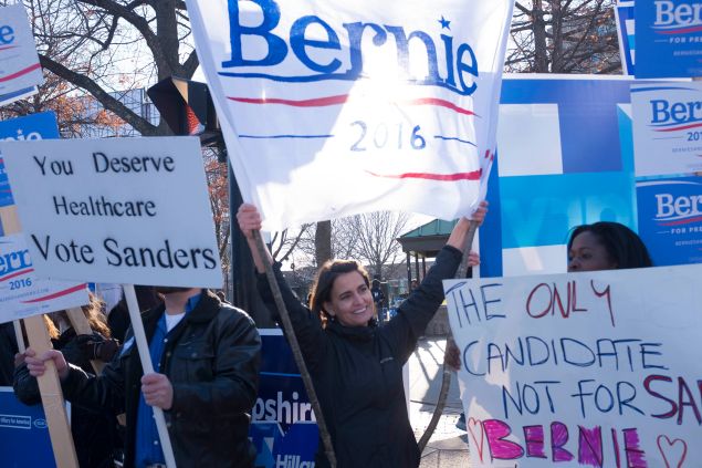 MANCHESTER, NH - NOVEMBER 29: Supporters hold signs for Democratic Presidential candidate Bernie Sanders outside the Radisson Hotel before the Jefferson Jackson Dinner November 29, 2015 in Manchester, New Hampshire. The dinner is held annually by the New Hampshire Democratic Party. (Photo by Darren McCollester/Getty Images)