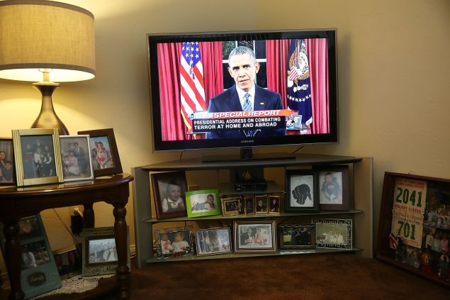 SAN BERNARDINO, CA - DECEMBER 06: U.S. President Barack Obama is seen on television in the home of Helen Medina, who had to hide as police engaged in a gun battle with terror suspects on the street in front, during his nationally-televised address from the White House about terrorism following the attack on the Inland Regional Center on December 6, 2015 in San Bernardino, California. Medina hid in her home as the police killed the terror suspects that attacked the Inland Regional Center in San Bernardino that left 14 people dead and another 21 injured on December 2. (Photo by Joe Raedle/Getty Images)